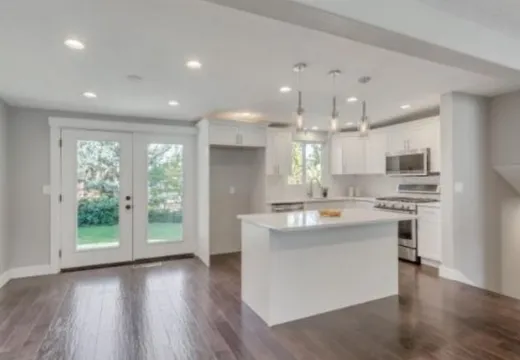 White shaker kitchen with island and pendant lights