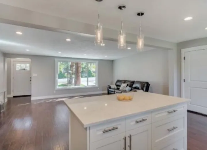Finished basement living room with clean trim and flooring